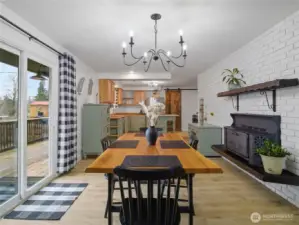Another view of the dining and kitchen areas with the 2nd cozy fireplace.