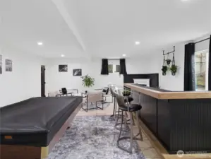 Basement w/ bar and water connected.