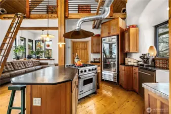 4 burner Viking range and a Saba industrial glass refrigerator