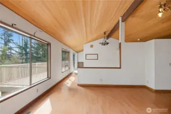 Living room looking toward dining. View deck off breakfast nook.
