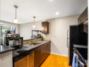 Cook in this kitchen while your friend entertain you by bellying up to the bar.
