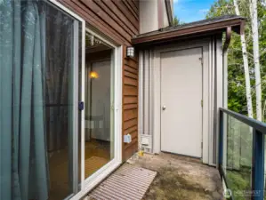 A private storage unit that holds a lot is located on the balcony.