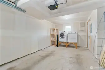 One car garage with laundry and storage area.
