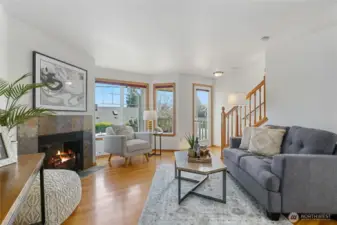 The main floor has hardwood floors and lots of natural light from three directions.  The gas fireplace was recently serviced.  New paint throughout.  Watch the sunrise over the Cascades from the front deck.