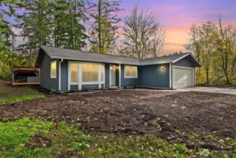 The exterior of the home has undergone a stunning transformation. With new exterior paint, a new garage door, stylish light fixtures, and fresh landscaping—including forestry mulching to clear the property of small trees and undergrowth, along with topsoil, bushes and bark—this home enhances both curb appeal and functionality. The newly paved driveway adds to the property's style and durability, making it a true oasis.
