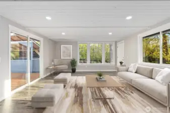 Step into the elegant living room, where sophisticated wood ceilings exude glamour and create a fantastic retreat for gaming or watching TV. This room is bathed in natural light streaming through abundant wood-wrapped windows, fostering a comfortable and inviting atmosphere. It also features a glass door leading to the backyard deck, and another door to the other side of the yard, allowing you to extend your entertainment outdoors perfect for hosting gatherings! Entertain in style in this cozy space, complemented by a wonderful floor plan designed for both comfort and enjoyment.