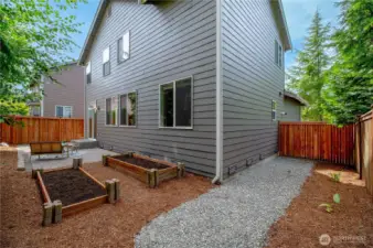 Fully fenced yard & raised garden beds for veggies or flowers.
