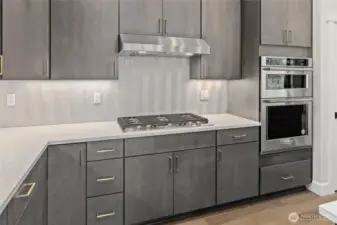Lovely cabinetry with gold handles.