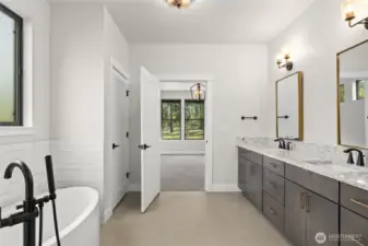 Five piece primary bath featuring solid countertops with undermount sinks.