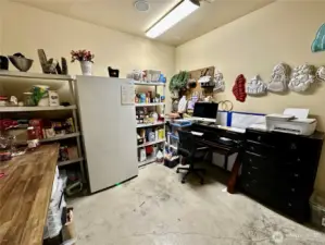 The hobby/craft room offers easy access from both the garage and laundry room.