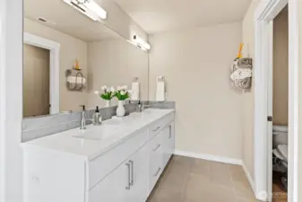 Spa inspired primary bath with large shower, soaking tub, and grand walk-in closet.