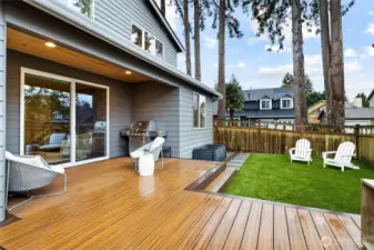 Entertainers dream backyard with Trex decking, pet friendly turf, and Hot Springs Highlife Collection Hot Tub, BBQ Gas Hookup