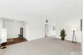 The entry features hardwood flooring and a convenient coat closet.