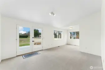 Separate living area with direct access to the back deck and yard.