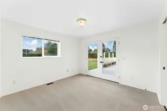 2nd bedroom featuring French doors that open to the deck.