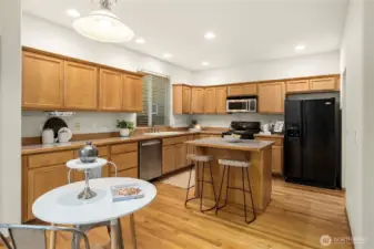 Kitchen with breakfast bar and eating area.