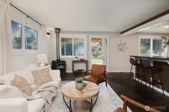 Looking back at the front entry. Generous counters with enough space for a few bar stools. Nice open connection between the living room and kitchen.