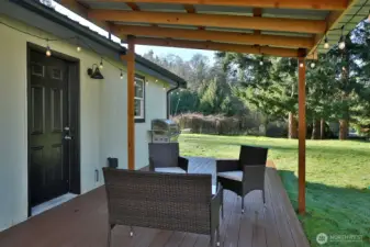 Covered side deck expands your living space to your spacious sunny yard.