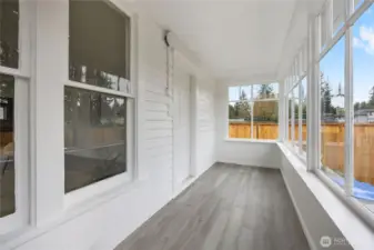 covered sunroom on front of home