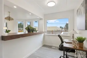 The other side of the elevated counter area provides space for an office, buttler's pantry, coffee nook, whatever best suits your needs.