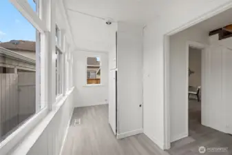 Covered back porch laundry area.