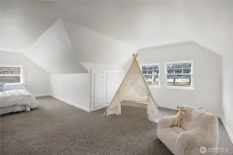 Plenty of "living space" in upstairs bedroom provides many possibilities.