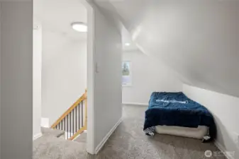 Smaller L shaped bedroom upstairs.