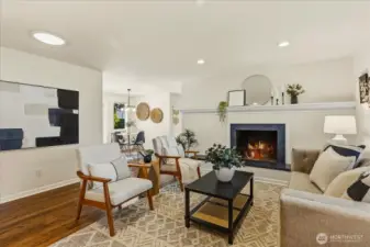 Hardwood floors and a cozy fireplace in living room