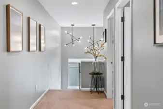 Upstairs landing with tall ceilings and modern fixtures.