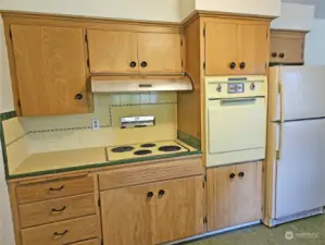 This cute kitchen has solid cabinetry and fun, retro appliances.