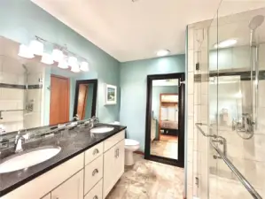 Double Sinks in and Walk in Shower with Glass Door in the Primary Bathroom