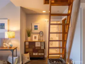 The ships ladder takes you to the loft area that can function as a home office, music room, sleeping space, or whatever you chose.