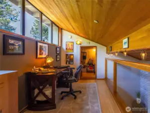 The cozy, functional loft adds space and character to this condo. Note the 10' x 10' bonus storage room in the background!  Great place to store your seasonal belongings.