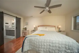 Spacious main bedroom with large ensuite bath, quartz counters and tile and glass walkin shower.