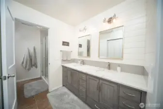 Large private bath, walkin shower with glass doors and tile. Gorgeous quartz counters.