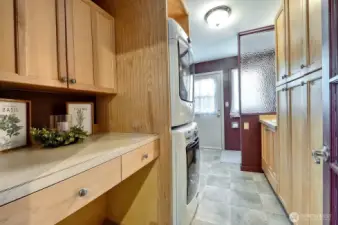 Laundry room and 1/2 bath off the kitchen.  Door leads to fenced backyard.