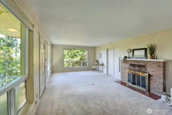 Front living room with wood burning fireplace.