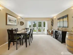 Dining room with french doors to easily access your trex deck.  Take in the viws of golf course and scenic pond.