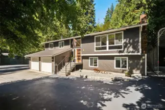 Welcome to your own private oasis in the heart of the highly sought-after Mirrormont neighborhood. New front porch was made more welcoming and a landscaped area created off to the right of the entry. The front door is also brand new and painted a cheery orange! Two brand new garage doors, and new "people" door was added to the side of the garage for easier access to the outside. Driveway was just re-sealed.