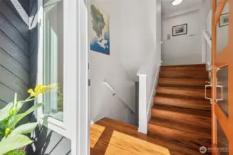 Enter in and enjoy the hardwood floors leading you upstairs to the main level great room, or downstairs to the huge rooms with many uses on the lower level.