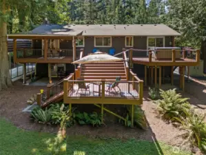 Two level deck in the back of the home takes advantage of the natural privacy of the property. There is even a small patio off the lower level huge family room that stays dry year round, and little kids swing is waiting for that next small person to use!