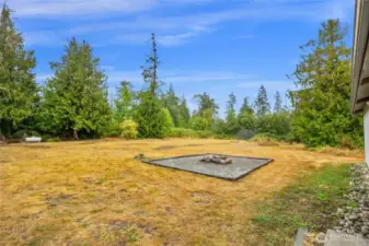 Level back yard with fire pit