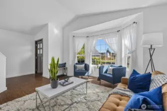 Soaring ceilings and expansive windows fill the home with light.