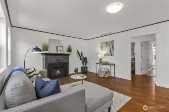To the right, a hallway leads to the laundry room and your main-floor primary retreat.