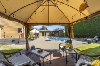The backyard even includes a gazebo with extra seating—because one hangout spot is never enough.