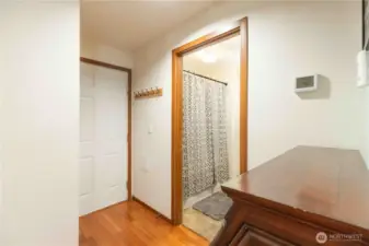 Hallway to garage (left) and bathroom (right)