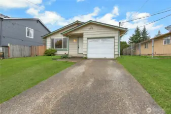 Rambler located on an elevated lot. 3 bd, 1 bath, 1 car.  "Grass is enhanced virtually"