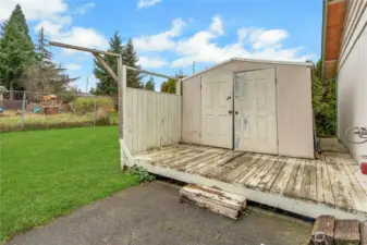 Back deck and storage shed, "Grass is enhanced virtually"