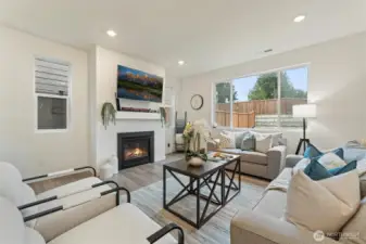 Another view of the living room highlighting the open layout and backyard sightlines.