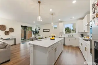 Open kitchen layout showcasing modern finishes, generous counter space, and excellent flow to living areas.